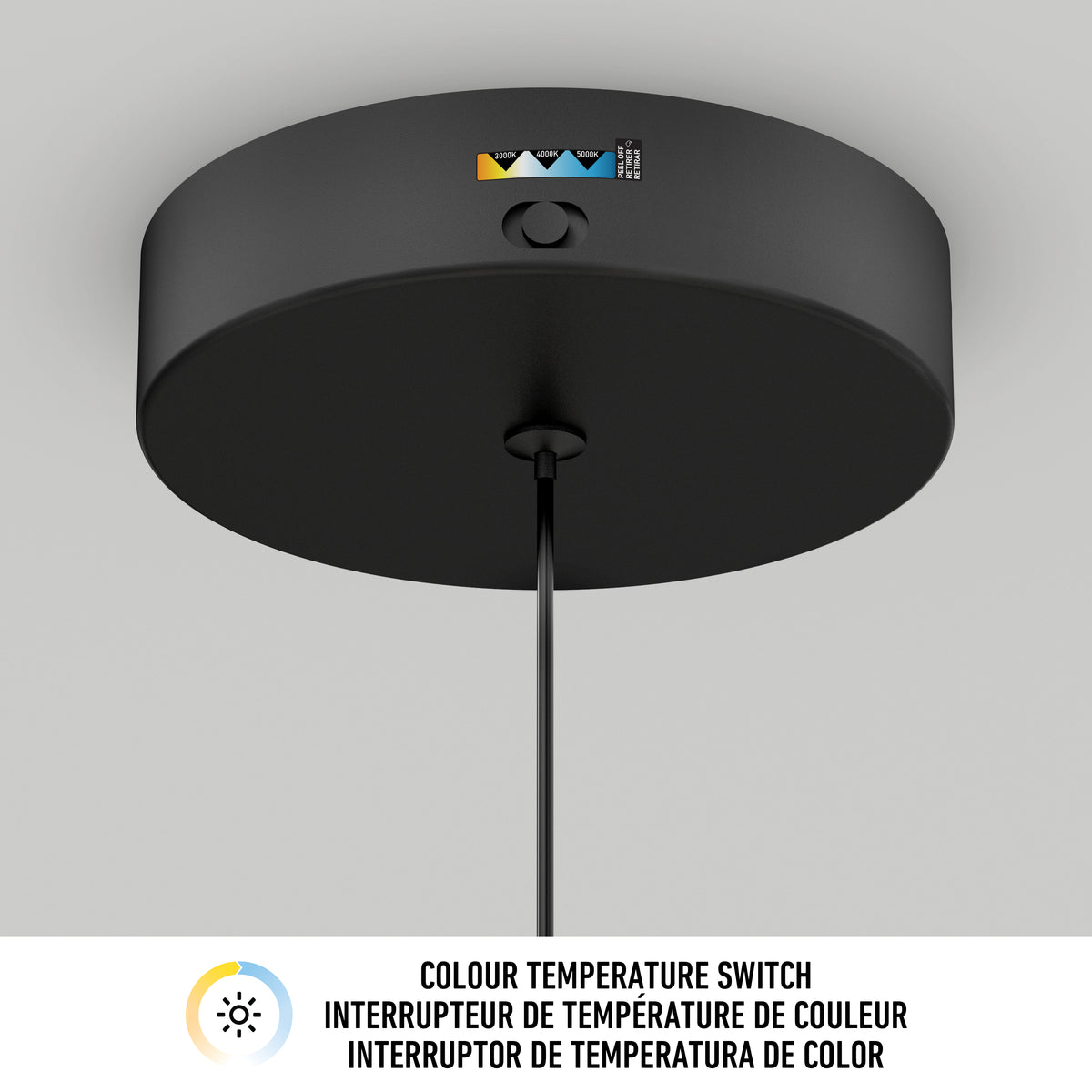 A close-up of a round black ceiling light fixture with a visible color temperature switch, shown against a white ceiling. Text below reads Colour Temperature Switch in English, French, and Spanish.