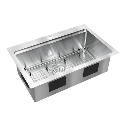 The Artika Newport single bowl stainless steel workstation sink features a metal bottom grid, centered drain, black soundproofing pads on the exterior, and a single faucet hole on the back edge.