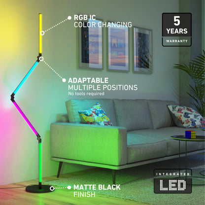 A modern living room features the Artika Fitch smart foldable RGB LED gaming floor lamp. Beside a gray sofa with colorful pillows, text highlights its color-changing LEDs, adjustable design, and 5-year warranty.