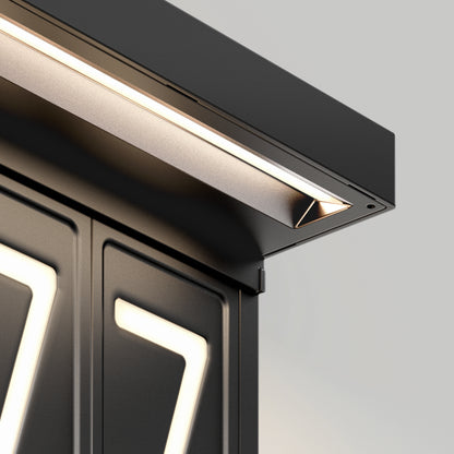 Close-up of the Artika Bowen solar LED outdoor address wall light 5 CCT, a modern black fixture with clean lines that brightly illuminates the number 7 in a sleek, minimalistic style and offers maintenance-free, soft warm lighting.