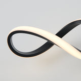 A modern, black and white LED light fixture forms a smooth, continuous infinity loop shape against a plain, light grey background.