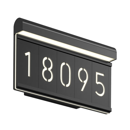 A modern, rectangular black address plaque with the numbers 18095 illuminated in white, mounted on a wall with integrated LED lighting along the top edge.