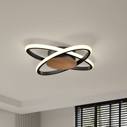 The Artika Atomic 15 in. LED flush mount light, featuring two intersecting illuminated rings and a wooden central base, is installed on a white ceiling near a window with horizontal black blinds.