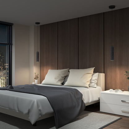 A modern bedroom with a double bed, white bedding, and a dark gray blanket. Wood-paneled walls and an Artika Cosmic modern LED pendant light 3 CCT enhance the space, while a white nightstand sits by the large window overlooking the city at night.