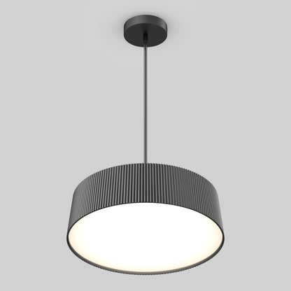 The Artika Groove Drum LED contemporary pendant light features a modern black ribbed cylindrical shade and central rod, providing a bright, diffused glow—perfect for illuminating any space with style.
