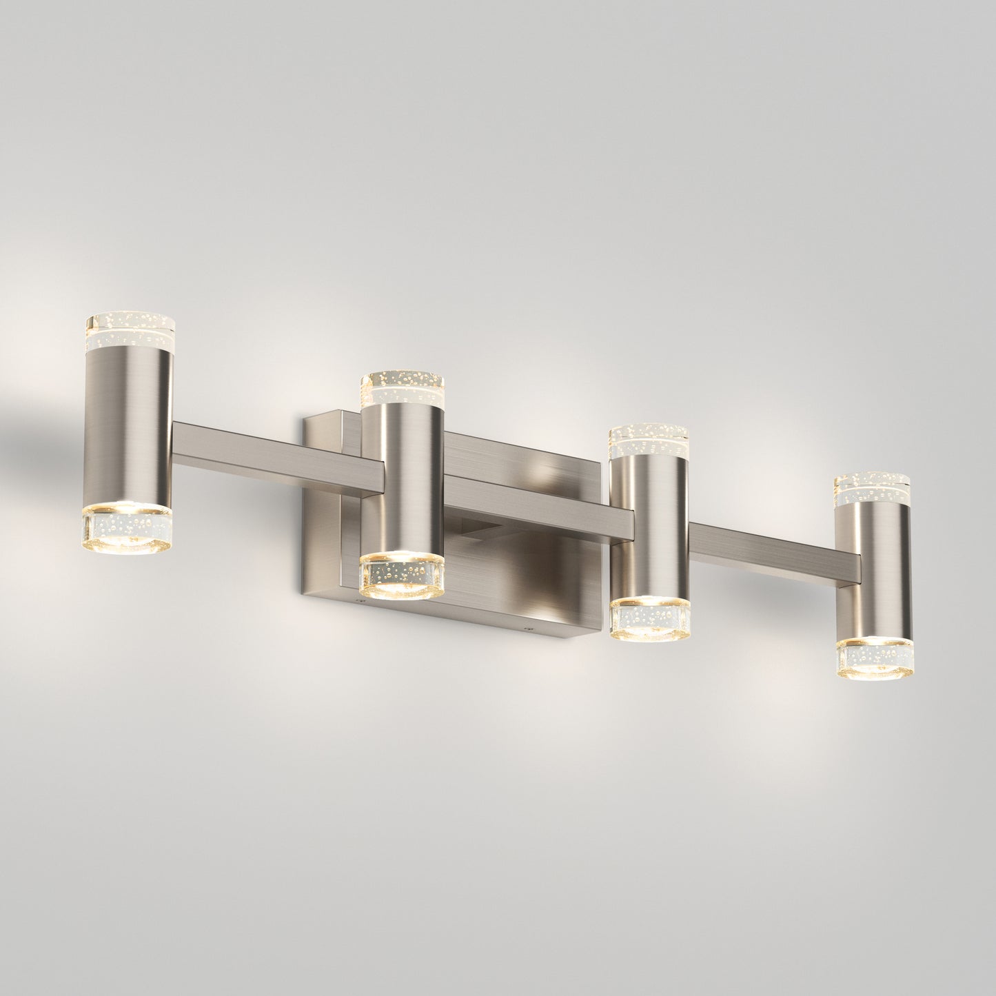 The Artika Mist modern LED bathroom vanity light 5 CCT features four cylindrical lights with clear textured glass ends and a brushed nickel finish, wall-mounted and set against a light gray background.