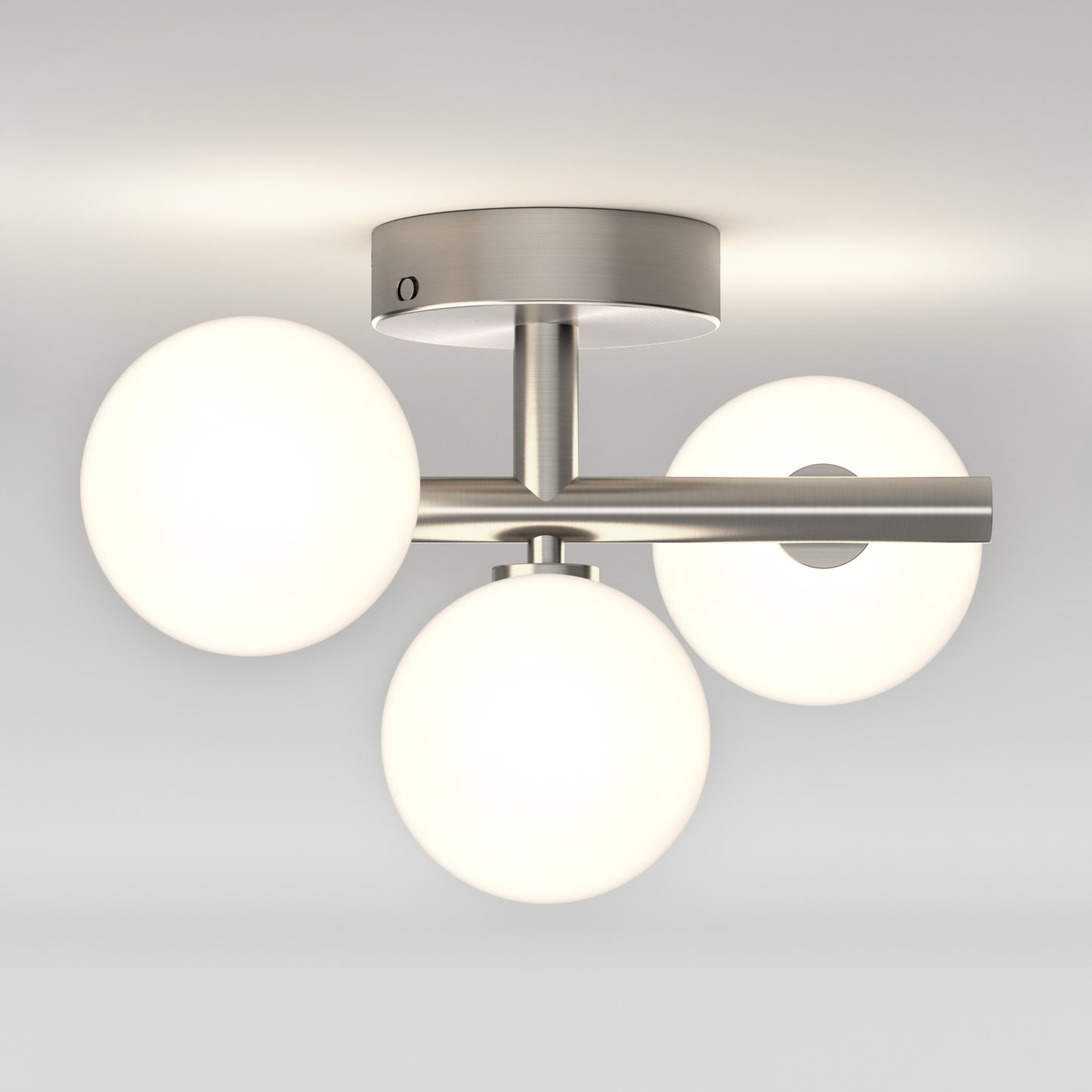 The Artika Bloom LED flush mount features a brushed metal base with three frosted glass globes in a triangular layout, perfect for mounting on a white ceiling.