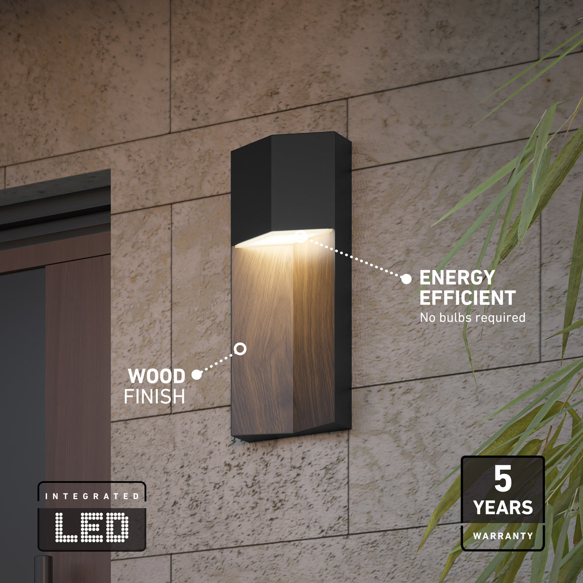 The Artika Howel modern LED indoor-outdoor wall light 5 CCT features a wood finish, integrated energy-efficient LEDs (no bulbs needed), a 5-year warranty badge in the bottom right, and some green plant leaves are visible.