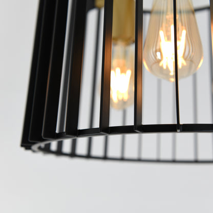 Close-up of the Artika Gatsby flush mount light, a modern black metal fixture with exposed Edison-style bulbs glowing warmly against a white background.