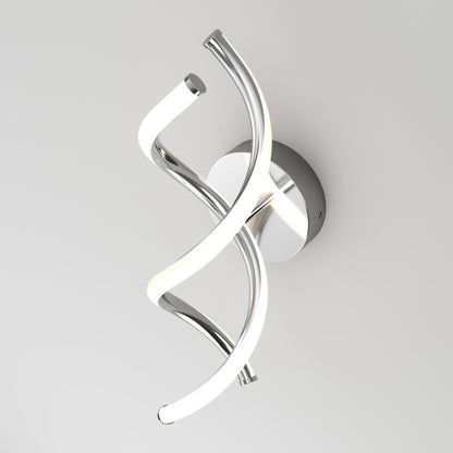 Modern wall sconce with two intertwined, twisting LED light tubes, one chrome and one illuminated white, mounted on a circular chrome base against a plain white background.