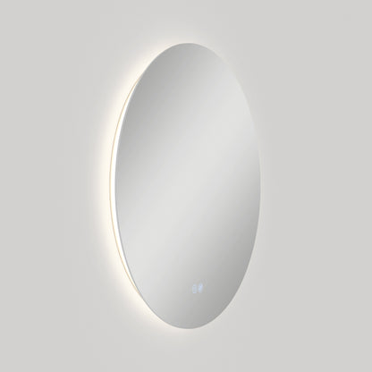The Artika-CAN-dev Raya 24 in. LED mirror features 3 CCT settings, a defogger, a round wall-mounted design with soft backlight, and two touch icons near the bottom, shown against a plain light gray background.