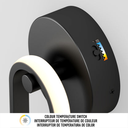 Close-up of the Artika Catena modern LED wall sconce 5 CCT, featuring a black finish and a color temperature switch with a slider and icons; multilingual text explains the switch in English, French, and Spanish.