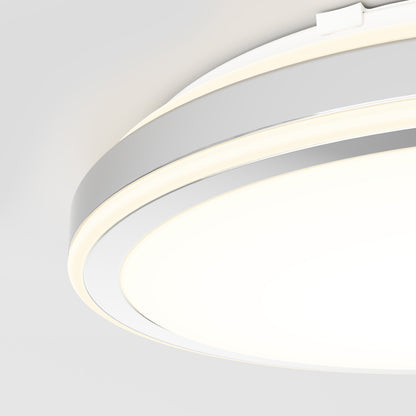 Close-up of the Artika Altitude 15 in. LED modern flush mount light (5 CCT), featuring a sleek white and metallic finish and providing a soft, even glow against a plain white ceiling.