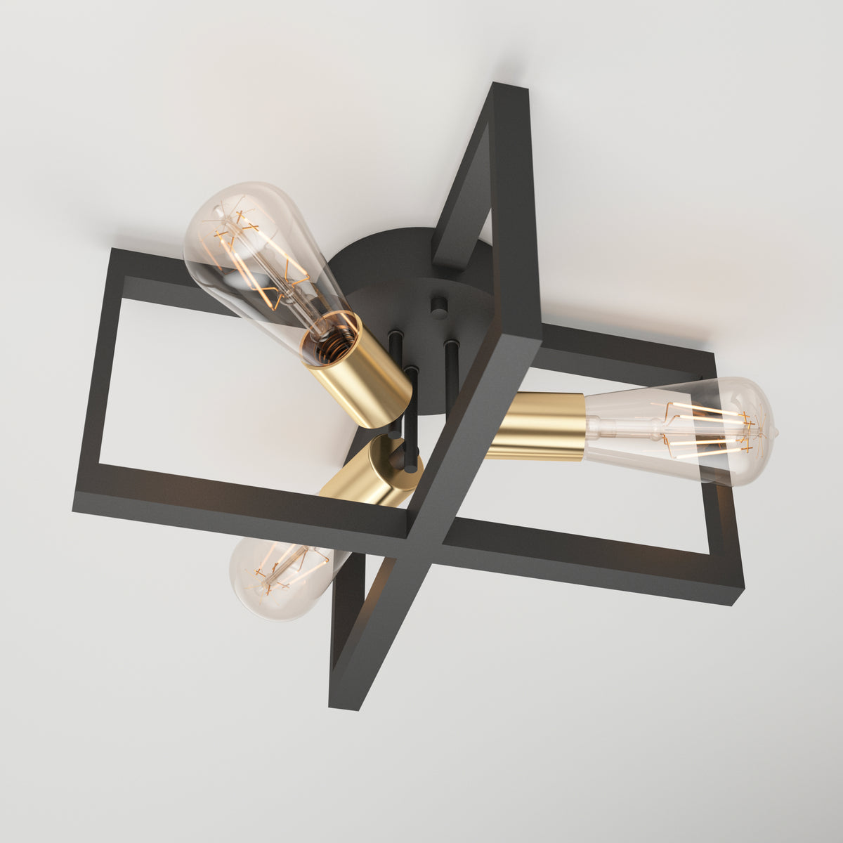 A modern ceiling light fixture with three exposed bulbs, gold sockets, and two intersecting black rectangular frames, mounted on a round black base against a white ceiling.