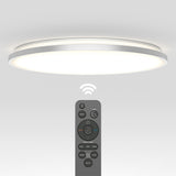 A modern, round ceiling light emits a bright glow. Below it, a remote control with various buttons and icons is pointed upward, and a wireless signal symbol is shown between the remote and the light.