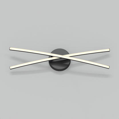 The Orly modern LED bathroom vanity light by Artika features two sleek illuminated bars crossing over a round black base, shown against a plain light gray background.