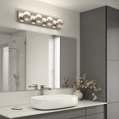 Modern bathroom featuring a large mirror, stylish oval sink, silver faucet, gray cabinets, a vase of pink flowers, and the Artika Oracle 4 light LED bathroom vanity light illuminating the space.
