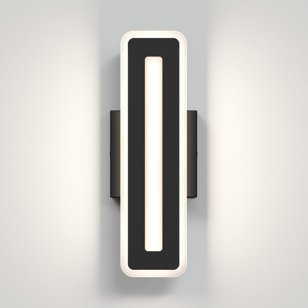 The Artika Evasion modern indoor-outdoor LED wall light 3 CCT features a sleek, black rectangular frame with rounded edges and a central light strip that casts a soft, even glow on any light-colored wall.