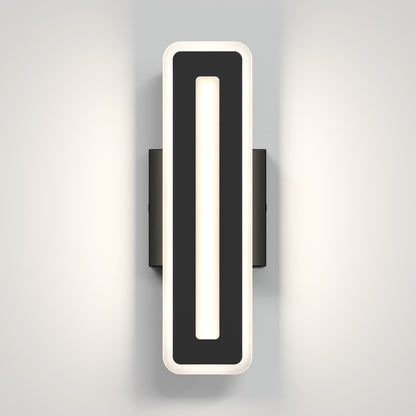 The Artika Evasion modern indoor-outdoor LED wall light 3 CCT features a sleek, black rectangular frame with rounded edges and a central light strip that casts a soft, even glow on any light-colored wall.