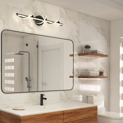 Modern bathroom with white marble walls, wood vanity with black faucet, floating shelves, and a Coda modern LED bathroom vanity light by Artika above the rectangular mirror. The shower is visible in the mirrors reflection.
