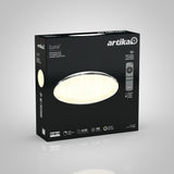 A black box with the Artika logo contains a Sparkle LED ceiling light. The packaging shows an image of the round light and a remote control, along with product details and icons highlighting its features.