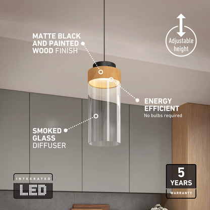 The Artika Hanson 1-light LED pendant features a wooden and matte black finish, smoked glass diffuser, adjustable height, energy efficiency, 5 CCT selectable integrated LED, and a 5-year warranty. Shown installed in a kitchen.