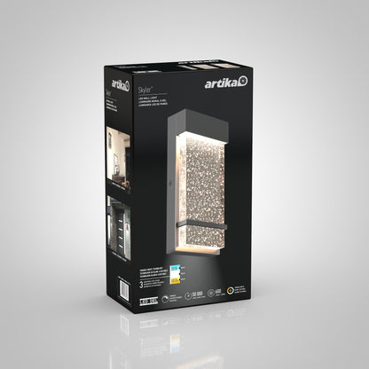 Artika Skyler indoor-outdoor LED wall light box displays the product image, features, and specs on a black background with white and blue text and icons.
