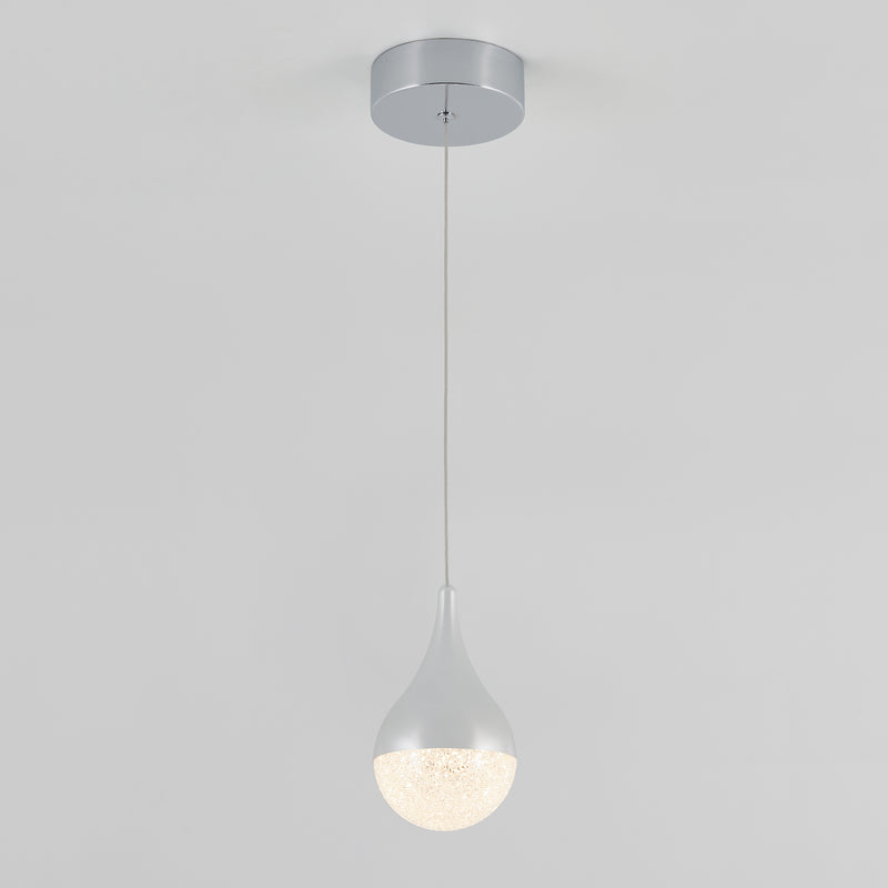 The Artika Glitzer LED pendant light features a silver round base, a thin cord, and a teardrop-shaped shade. Its lower part glows with soft, diffused light, creating a modern look against any plain background.