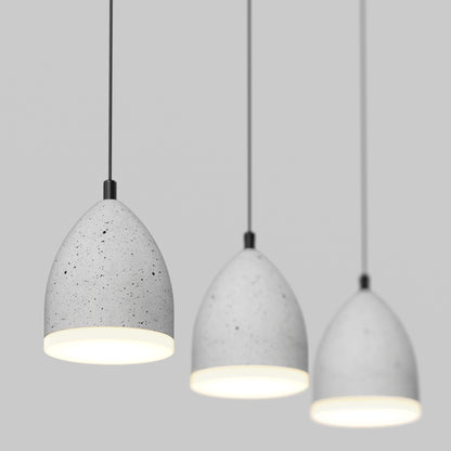 The Artika Bergen 3-light LED pendant features gray, speckled dome shades hanging against a plain light gray background, each illuminated to create a soft, modern glow.