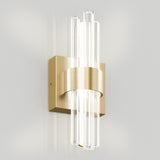A modern wall sconce with a brushed gold rectangular base and a horizontal gold band, featuring vertical clear glass rods that emit soft white light.