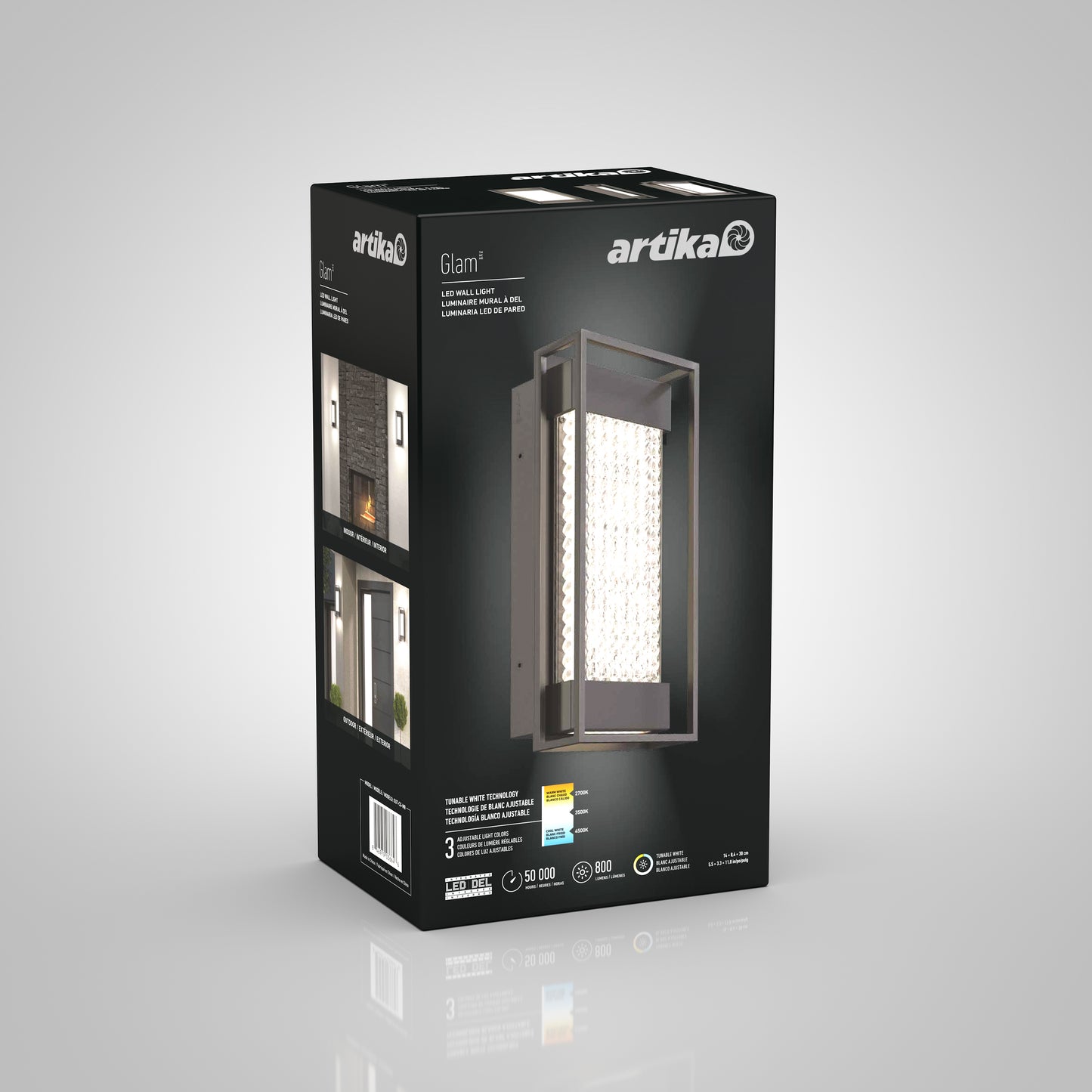 A 3D-rendered box for the Artika Glam indoor-outdoor LED wall light displays an image of the rectangular fixture with a crystal-like insert, product details, and photos of it installed on a modern exterior wall.
