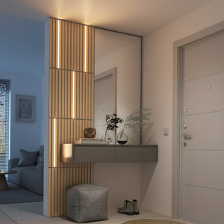 Modern entryway with Artika Lumilok LED Wall Panel Light for Sonolok, floating console, decor, and gray pouf on tiled floor.