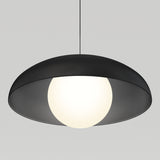 A modern pendant light with a black, dome-shaped shade and a glowing white spherical bulb, suspended by a thin black cord against a plain light gray background.