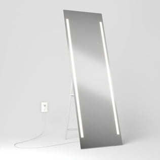 The Artika Emeraude 19"x59" full-length floor mirror features two vertical LED strips and stands on the floor.