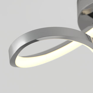 A close-up of Artika's Loop modern LED flush mount light 3 CCT, featuring a sleek curved infinity-loop design against a plain background.