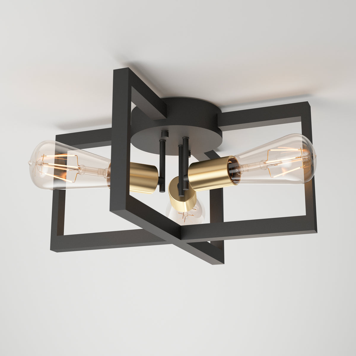 The Artika Holt 3-light flush mount features gold sockets and intersecting black rectangular frames with exposed Edison bulbs, mounted on a white ceiling.