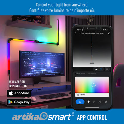 A modern gaming setup features the Artika Fitch smart foldable RGB LED gaming floor lamp. A smartphone controls colorful lighting via app, with App Store and Google Play logos highlighting smart control features.