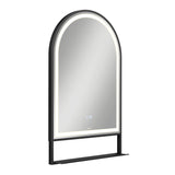 A modern, arched wall mirror with a black frame and built-in LED lighting around the inner edge. The mirror features a small touch control panel on the surface and a narrow black shelf at the bottom.