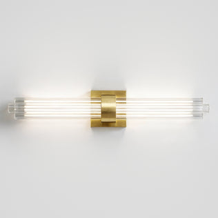 The Artika Dorado 27 in. 1-Light LED Wall Vanity offers dimmable, modern bathroom lighting with a brass accent and four glass rods.