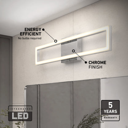 The Artika Dover modern LED bathroom vanity light 5 CCT, with a sleek chrome finish and integrated LED, is mounted above a mirror. Text notes its energy efficiency and 5-year warranty. Green plants appear at the bottom of the image.