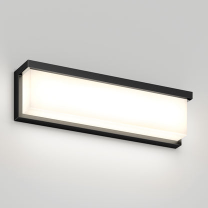 The Artika Bristol modern LED bathroom vanity light 3 CCT features a black frame and frosted white cover, mounted on a light gray wall, providing a soft, even glow.