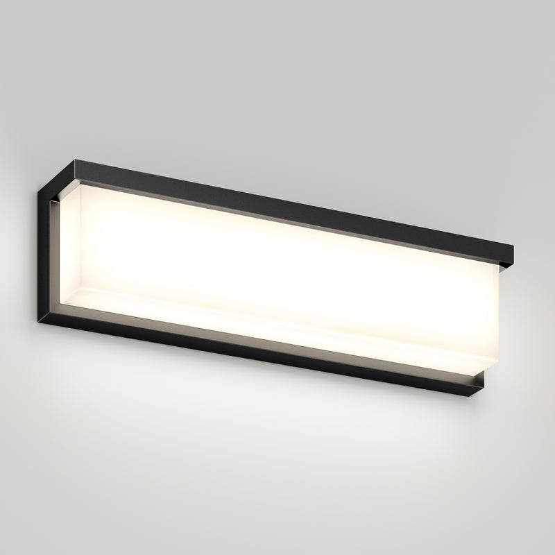 Artika Bristol modern LED bathroom vanity light 3 CCT with black frame and frosted cover, shown on a light gray wall.