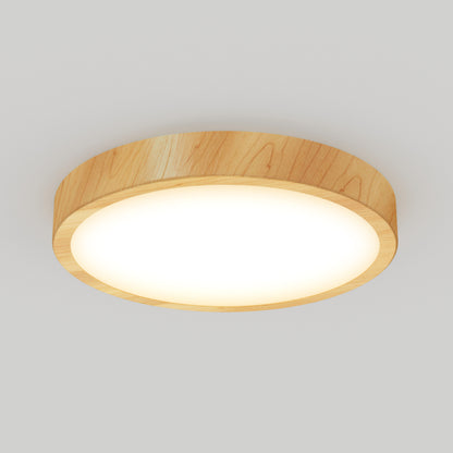 The Artika Dryad 15 in. LED Modern flush mount light features a round wooden frame and glowing white center, creating a contemporary look when mounted on a plain white ceiling.