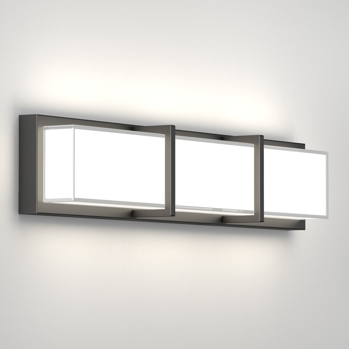 A modern wall-mounted light fixture with three rectangular frosted glass panels, each framed in black metal, mounted on a sleek horizontal base against a plain white wall.