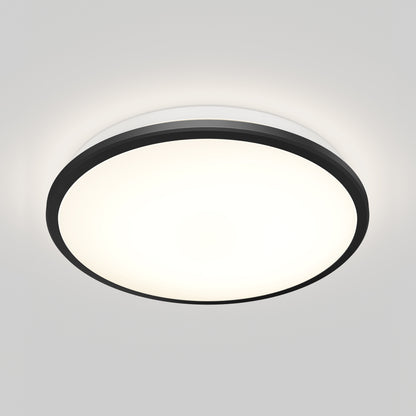The Artika Vera 13 in. LED modern flush mount light features a black outer rim and white frosted center, installed on a white ceiling. The light is on, casting a bright, even glow.