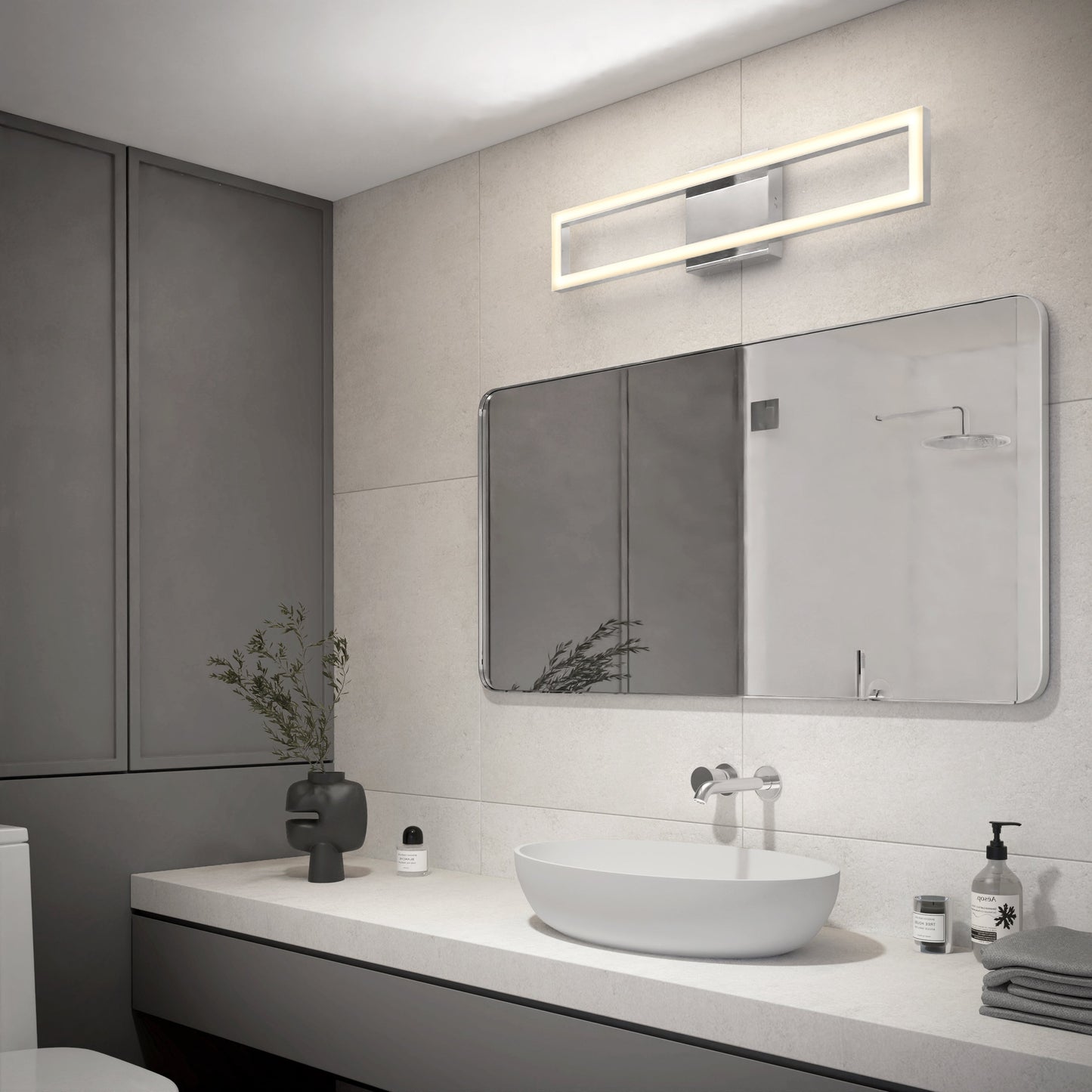 Modern bathroom with a large rectangular mirror, vessel sink, minimalist accessories, and the sleek Artika-CAN-dev Dover modern LED bathroom vanity light 5 CCT above the mirror. Light walls contrast with dark side cabinetry.