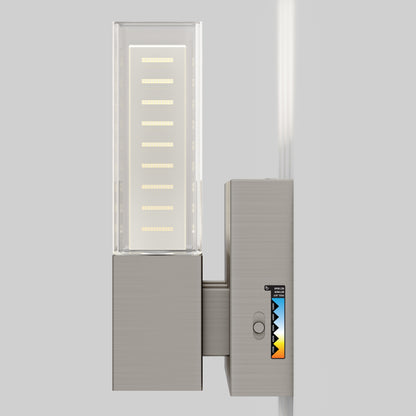 The Artika Hologram LED modern bathroom vanity light 5 CCT features a wall-mounted metal base, a rectangular frosted glass shade, and a small display with a colored triangle pattern on the right side.