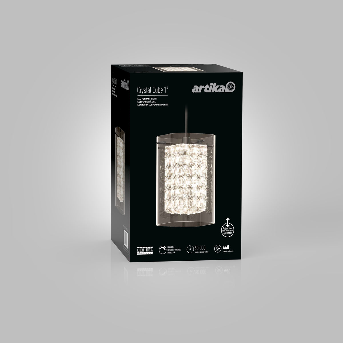 A black box packaging of the Artika Crystal Cube 1 light fixture, featuring an image of the crystal pendant light on the front, product specs, and branding on a gray background.
