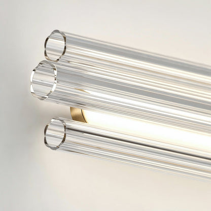 Artika’s Dorado 27 in. LED Wall Vanity features three clear glass tubes for soft, modern bathroom lighting against a white background.