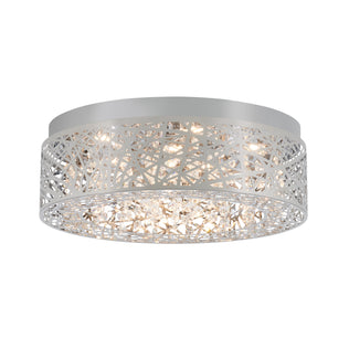 The Artika Crystal Nest LED flush mount is a modern ceiling light with a round silver metal frame, geometric cutout pattern, and sparkling crystal accents.
